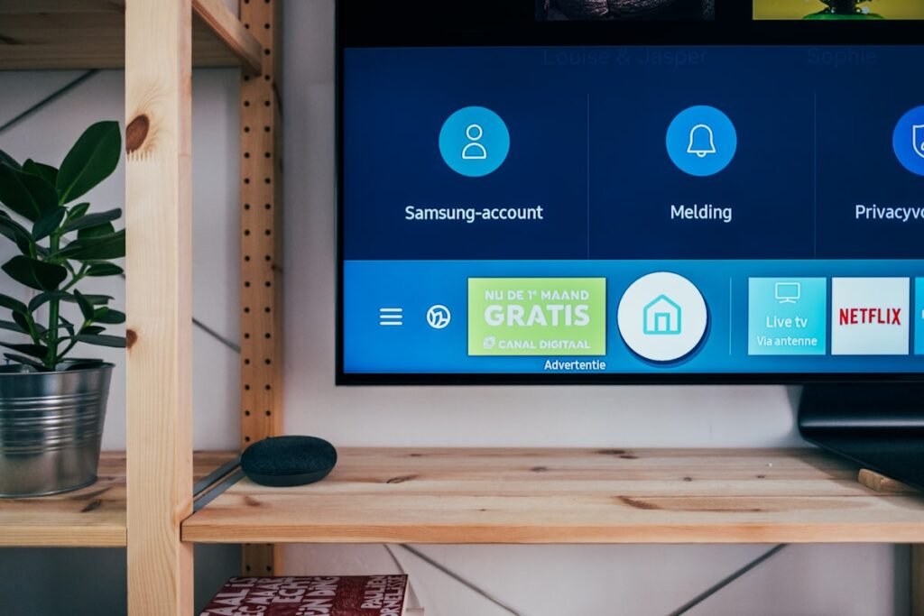 Best IPTV for sports — Streaming stick plugged into the back of a TV with cable | OTT-TV [ott-fm-v2]