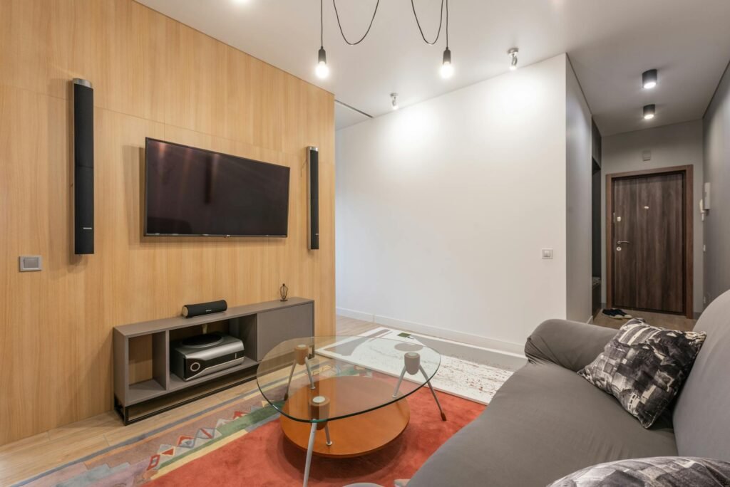 Best IPTV Service in 2026 — Contemporary apartment interior with a couch facing a flat-screen TV | OTT-TV