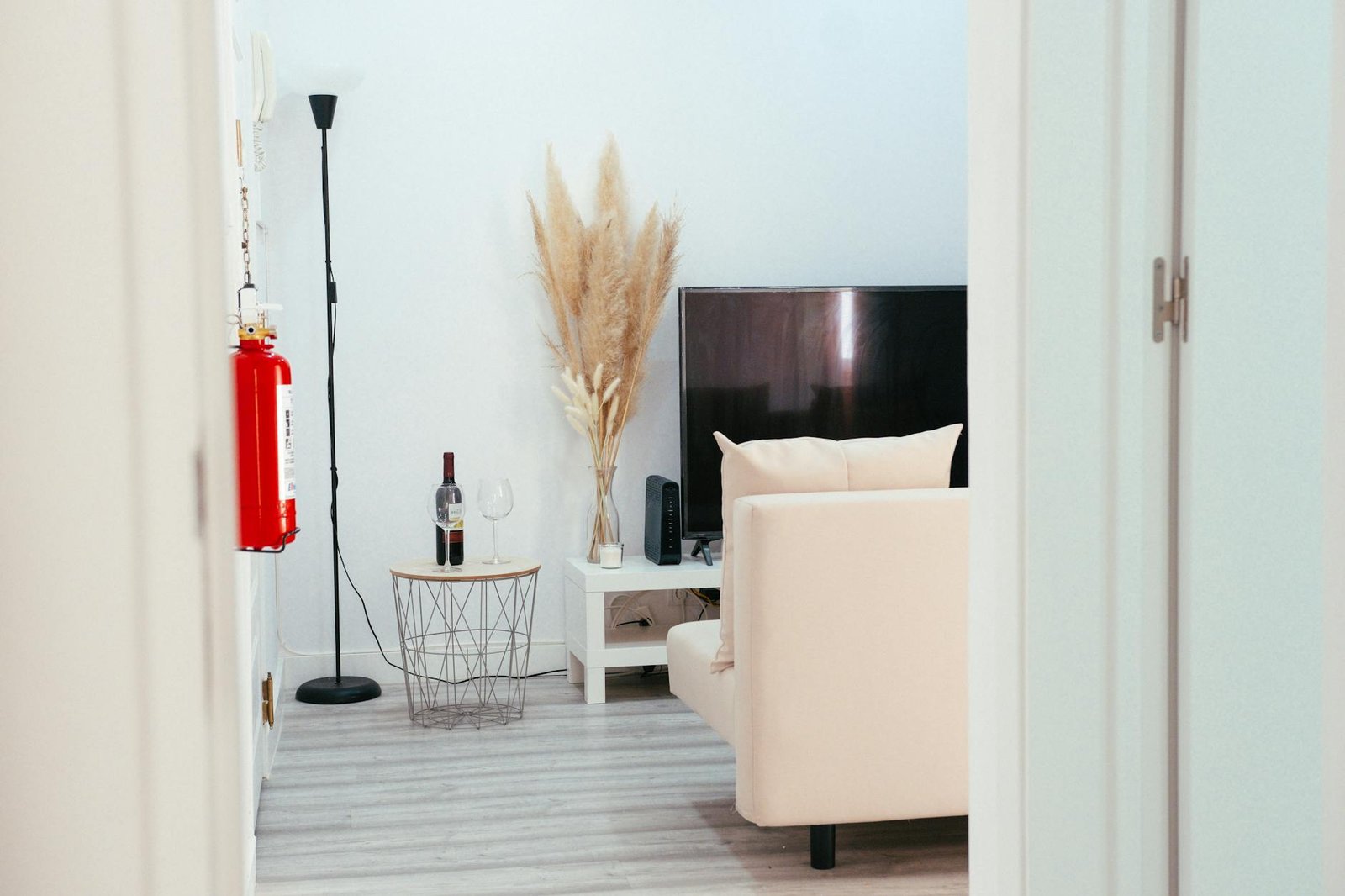 Compare IPTV Services Side by Side — Modern living room with a wall-mounted flat-screen TV | OTT-TV