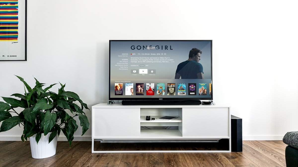How IPTV Works — IPTV streaming on a modern flat screen TV in a clean living room | OTT-TV [ott-fm-v1]