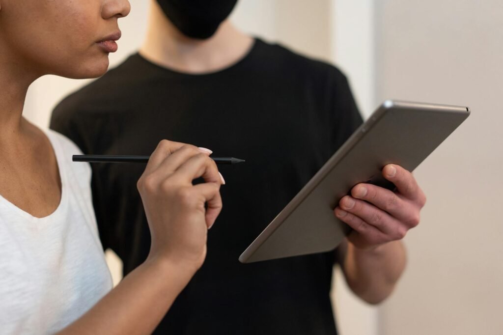 IPTV Free Trials — Two people interacting with a tablet during a sign-up flow | OTT-TV